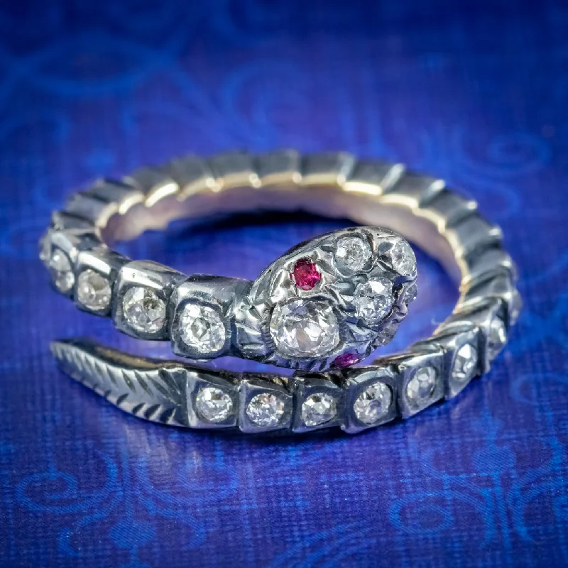 Art Deco - Inspired Women's Diamond Rings with Geometric Designs and Baguette - Cut DiamondsGeorgian Style Diamond Snake Eternity Ring