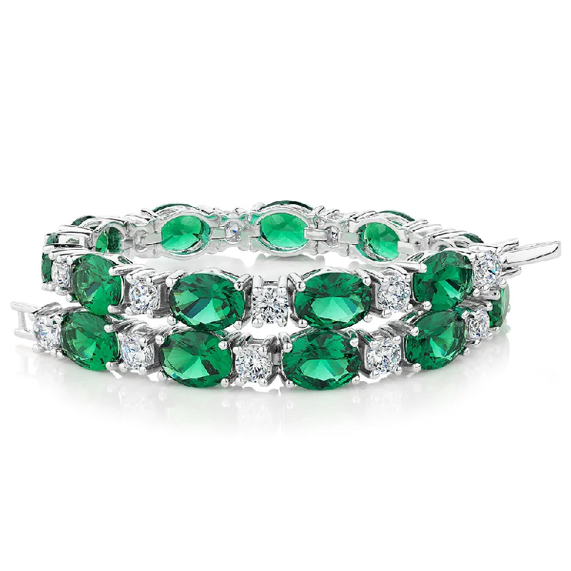 Adjustable Bangle Bracelets with Magnetic Closures for Easy Wear and RemovalRound Brilliant tennis bracelet with emerald simulants and 3.36 carats* of diamond simulants in sterling silver