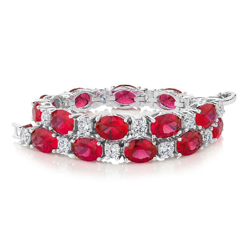 Stretch Bangle Bracelets with Elastic Cord for a Comfortable FitRound Brilliant tennis bracelet with ruby simulants and 3.36 carats* of diamond simulants in sterling silver