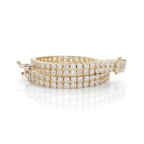 Leather - Wrapped Bangles with Studded Details for a Rock - Chic VibeRound Brilliant tennis bracelet with 13.86 carats* of diamond simulants in 10 carat yellow gold