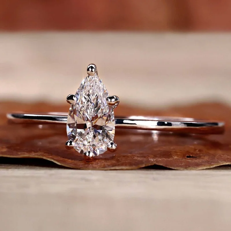 Cathedral - Style Engagement Rings with a Raised Center Stone and Intricate MetalworkPear Cut Lab Grown Diamond Solitaire Engagement Ring