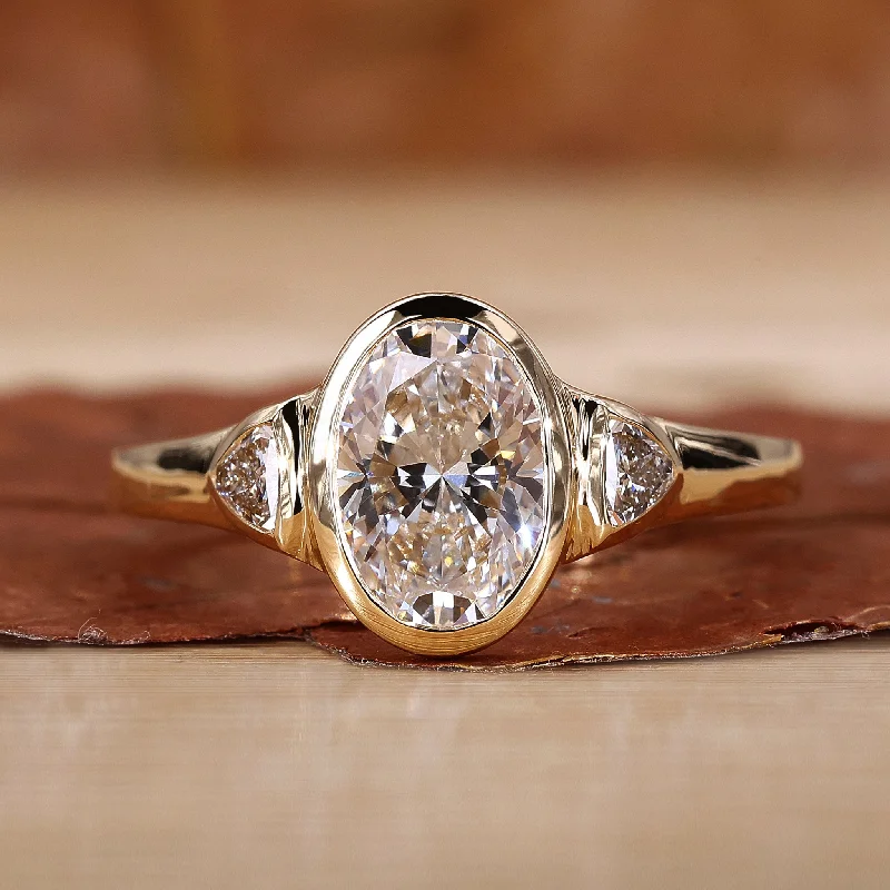 Engagement Rings with Sapphire and Diamond Combinations in a Vintage StyleThree Stone Oval Engagement Ring Modern Beauty